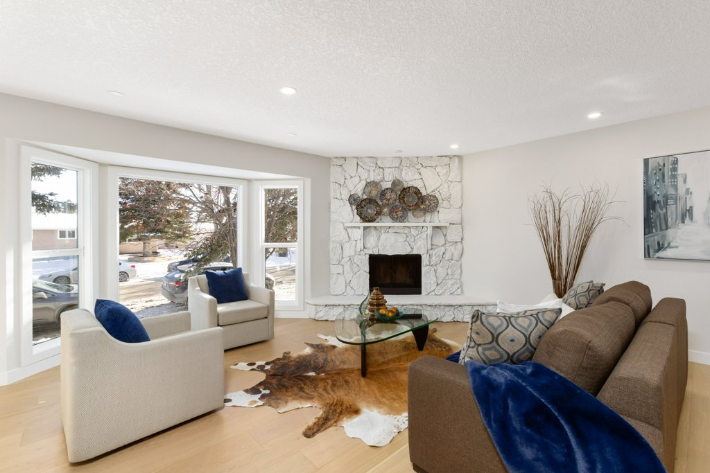 Real Estate Photography. A premium interior photo of a living room photographed by Ryan Haggel from Calgary Premium Real Estate Photography.